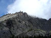 Clouds weave in and out of the crags on Kit Carson's northwestern slopes....