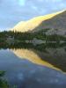 Timber Lake reflects the last few rays of the setting sun on Clark Peak's n...