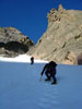Michael and Fabio climb the snow apron below the beginning of the couloir p...